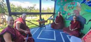 Gompa porch with visiting and resident nuns