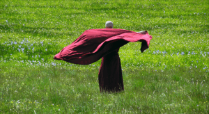 A female monastic  celebrating the goodness of the Rabjungma Community