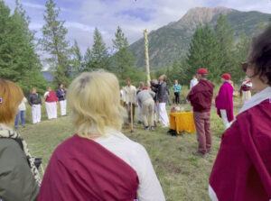 Temple blessing ceremony; students erect the multi--colored maypole from a recent retreat exploring the Western Mysteries part of our lineage