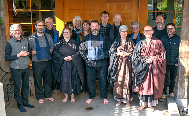 Participants from the fall Seattle Soto Zen sesshin. From left to right Tom Phillips, Nathan Britton, Michael Gillespie, Kanshin Alison Tait, Christina Johnson, unknown, Samantha Hilbert, Shuso Daiho Chris Middleman, Ilia Demianenko, Marco Beghin, Myoshin Kate McCandless, Susan Hautala, Shinmon Michael Newton, Benjamin Luedke, and Chris Reath