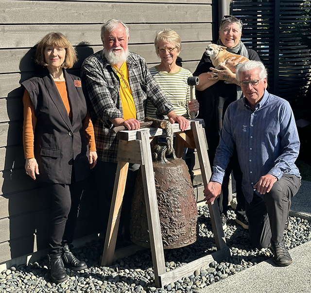 Completed bronze bell by artist Tom Jay, with current members of the Camas Hall Board of Directors, left to right: Tree Swenson, Bill Porter (Red Pine), Carolyn Law, Pamela Sampel (holding Millie), and Walter Parsons.  Not pictured: Marty Cole