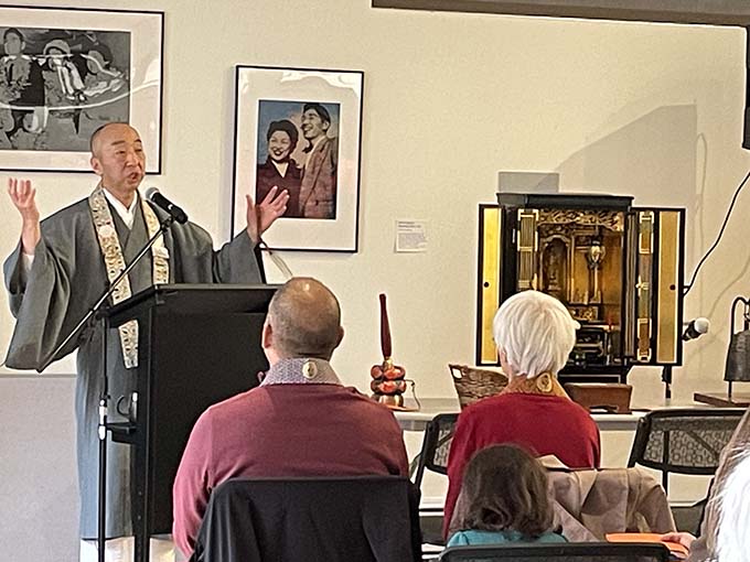 In December Sunday service returned to borrowed space at the Densho Digital Repository’s community room, while the gym is being renovated. Head Minister Rev. Katsuya Kusunoki is shown giving the dharma message beside the borrowed home altar.