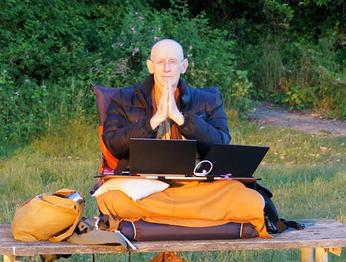 Bhikshu Dharmamitra often does his translating on a  bench in Seattle’s Lincoln Park, overlooking Puget Sound.