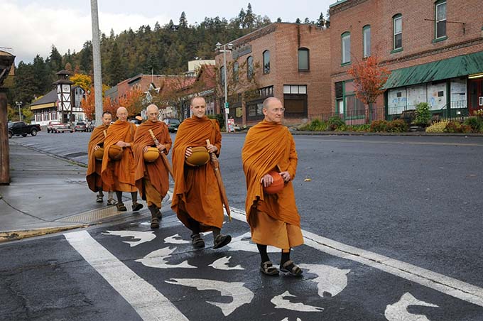 Led by senior monastic Ajahn Passano, monks walk for alms in downtown White  Salmon, Washington.