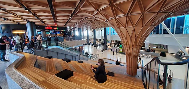 The entrance area of the new Concourse C at Seattle International Airport features restaurants on the lower level, and the new prayer and meditation room on the top floor